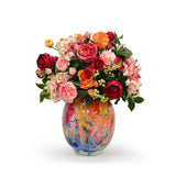Colorful bouquet of roses in a multicolored vase on a white background