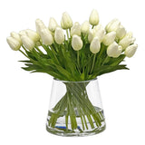 Elegant white tulips hand-crafted and arranged in clear cylinder vase, placed against a white background