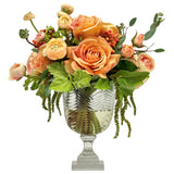 Real Touch rose and ranunculus floral arrangement with dusty coral blooms greenery and cascading accents in a striped cut glass vase.