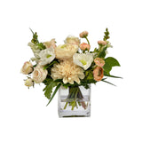 Real Touch rose and ranunculus floral arrangement with dusty coral blooms greenery and cascading accents in a striped cut glass vase.