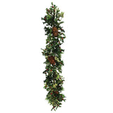 Hand-crafted pointed holly garland with variegated green foliage and berry accents and pinecones for festive decor against a white background