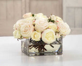 Elegant faux white and champagne rose arrangement in a clear glass vase with realistic faux water