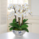 Luxury faux white phalaenopsis orchid arrangement in a blue and white rose trellis chinoiserie bowl