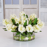 White hyacinth water garden arrangement in a clear cylinder glass vase