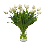 White tulip floral arrangement in a clear glass vase