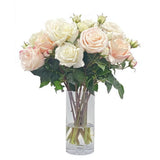 Real Touch mixed rose arrangement with blush pink, cream, and white blooms displayed in a tall clear glass vase.