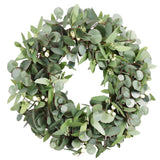 Realistic eucalyptus wreath with layered green foliage on a natural twig base