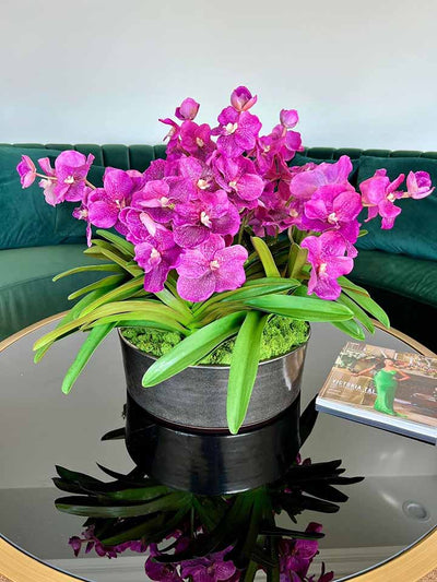 Vibrant purple faux vanda orchids centerpiece for coffee table