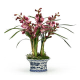 Cymbidium orchid arrangement in a decorative ceramic oval pot
