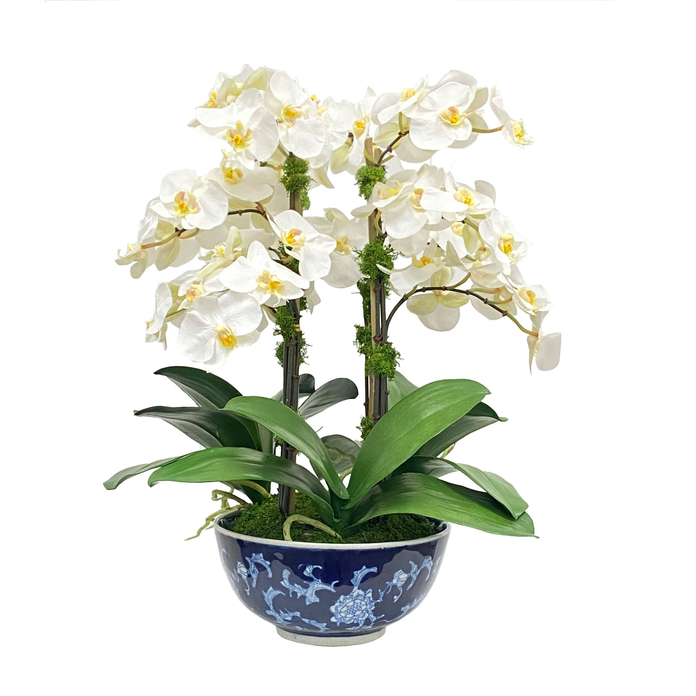 contemporary faux orchids arrangement in a classic blue and white porcelain bowl