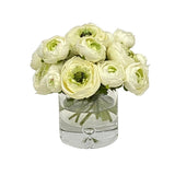 White Real Touch ranunculus floral arrangement in a clear glass vase with layered blooms and visible stems.