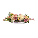 Cafe au lait faux floral arrangement in clear glass vase with roses, hydrangeas, tulips, and dahlias for dining table décor