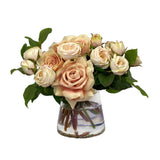 Compact faux rose arrangement in clear glass vase with neutral toned blooms for coffee tables and elegant home décor