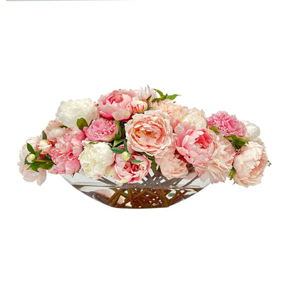 The world's most realistic and best faux flower centerpiece arrangement showing handpainted pink peonies in a boat-shaped oval glass vase