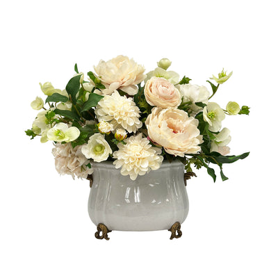 High-end real-touch faux floral arrangement in porcelain planter and brass details on white background