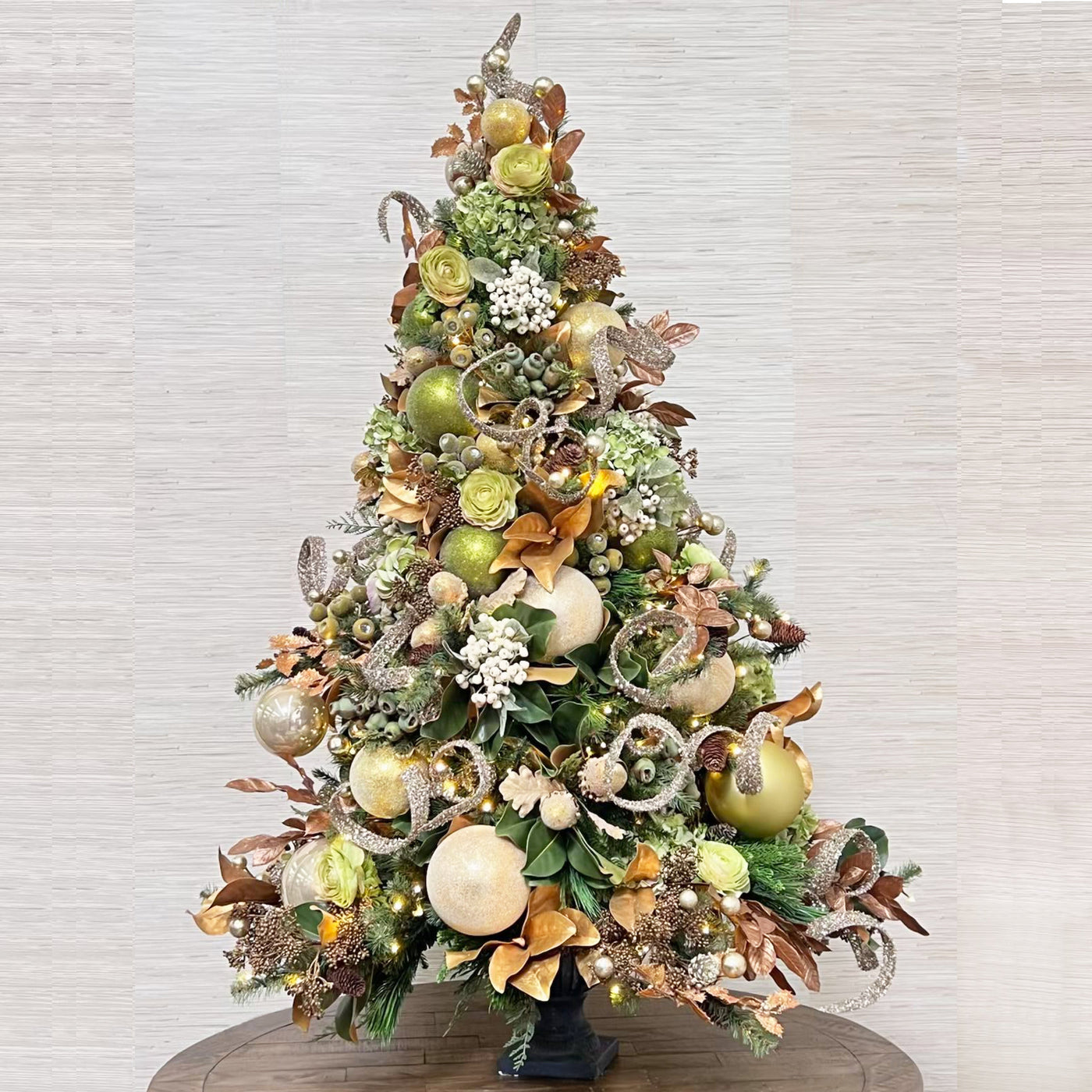 luxury pre-decorated ornament Christmas tree with green and gold decorations