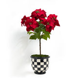 luxury faux poinsettia potted in a black and white checkered planter perfect for holiday decorating