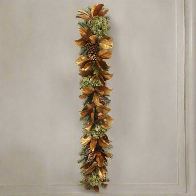 luxury faux holiday garland green and gold pre-decorated with hydrangea, pine cone, and magnolia leaves