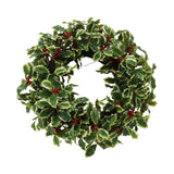 Hand-crafted holly branch wreath with variegated leaves and red berries, displayed against a white background