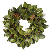 Hand-crafted magnolia leaf and mixed pine wreath with green accents, displayed against a white background