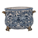 Small white and blue porcelain pot with handles and foot