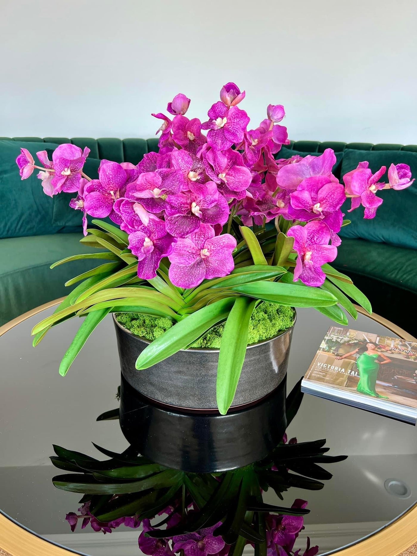 Vibrant purple faux vanda orchids centerpiece for coffee table