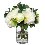White faux peony bouquet arrangement in a clear glass vase with eucalyptus greenery