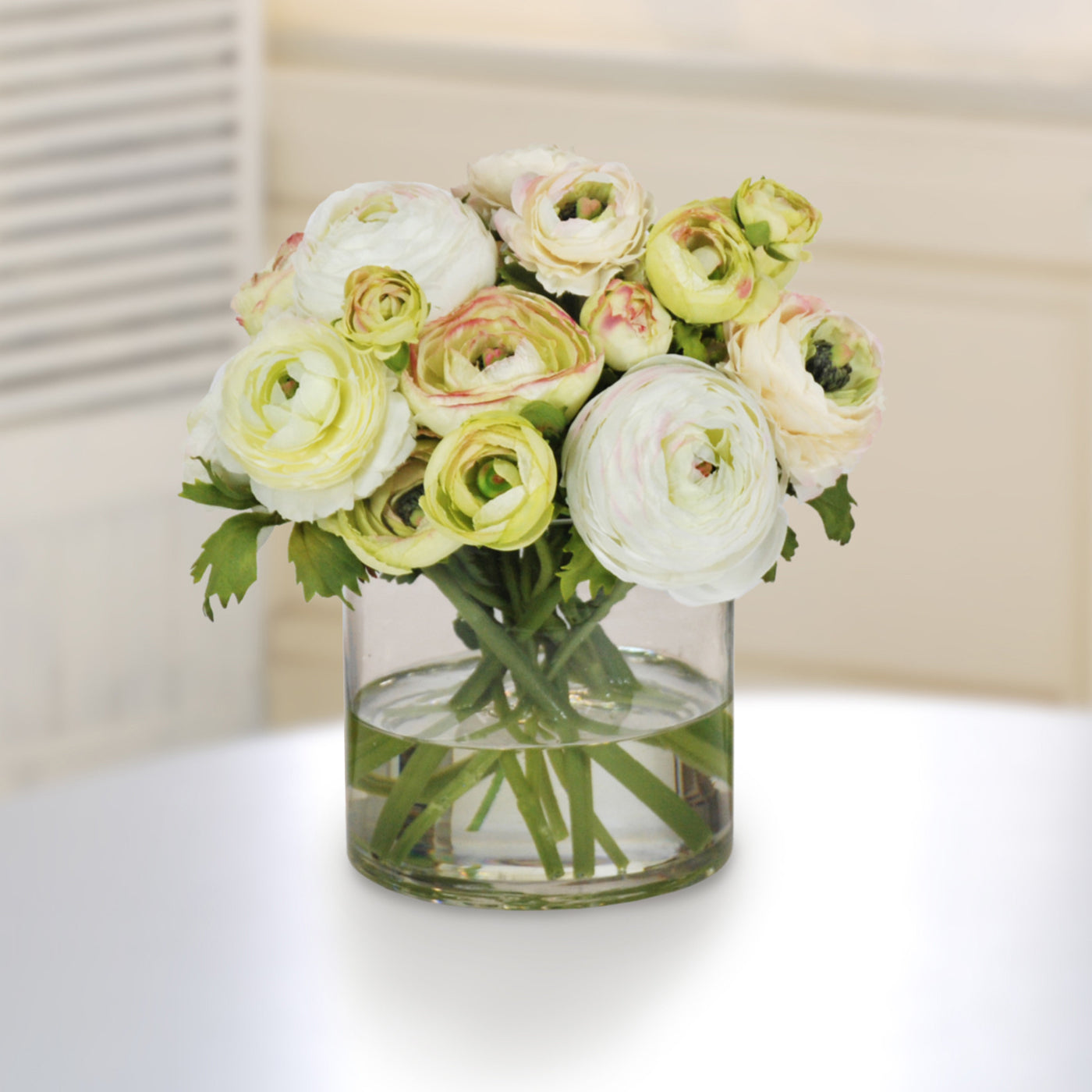 high-quality realistic faux ranunculus arrangement in glass vase