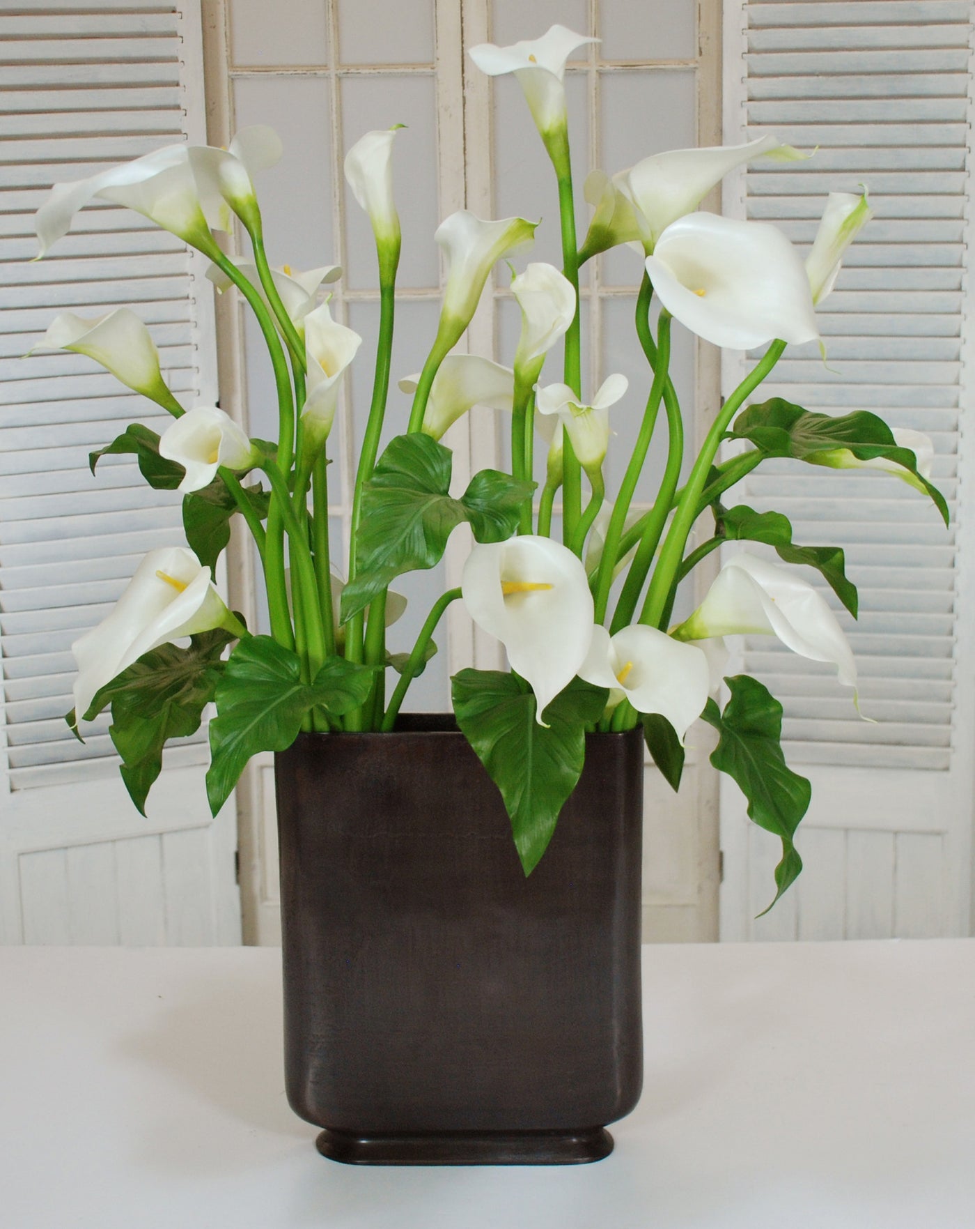 CALLA LILY IN  PROFILE VASE (TALL) (WHD075.WH ) - Winward Home faux floral arrangements