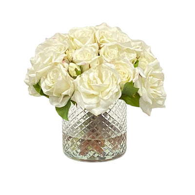White roses in diamond cut glass vase