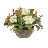 White magnolia arrangement in a textured modern decorative bowl