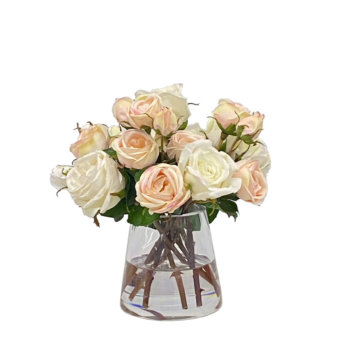 realistic looking faux roses in light pink and white in a glass vase