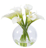 Soft-toned faux peony floral arrangement in a clear glass vase styled for elegant modern interior décor.