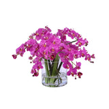 Luxury faux purple phalaenopsis orchid arrangement displayed in a clear cylindrical glass vase